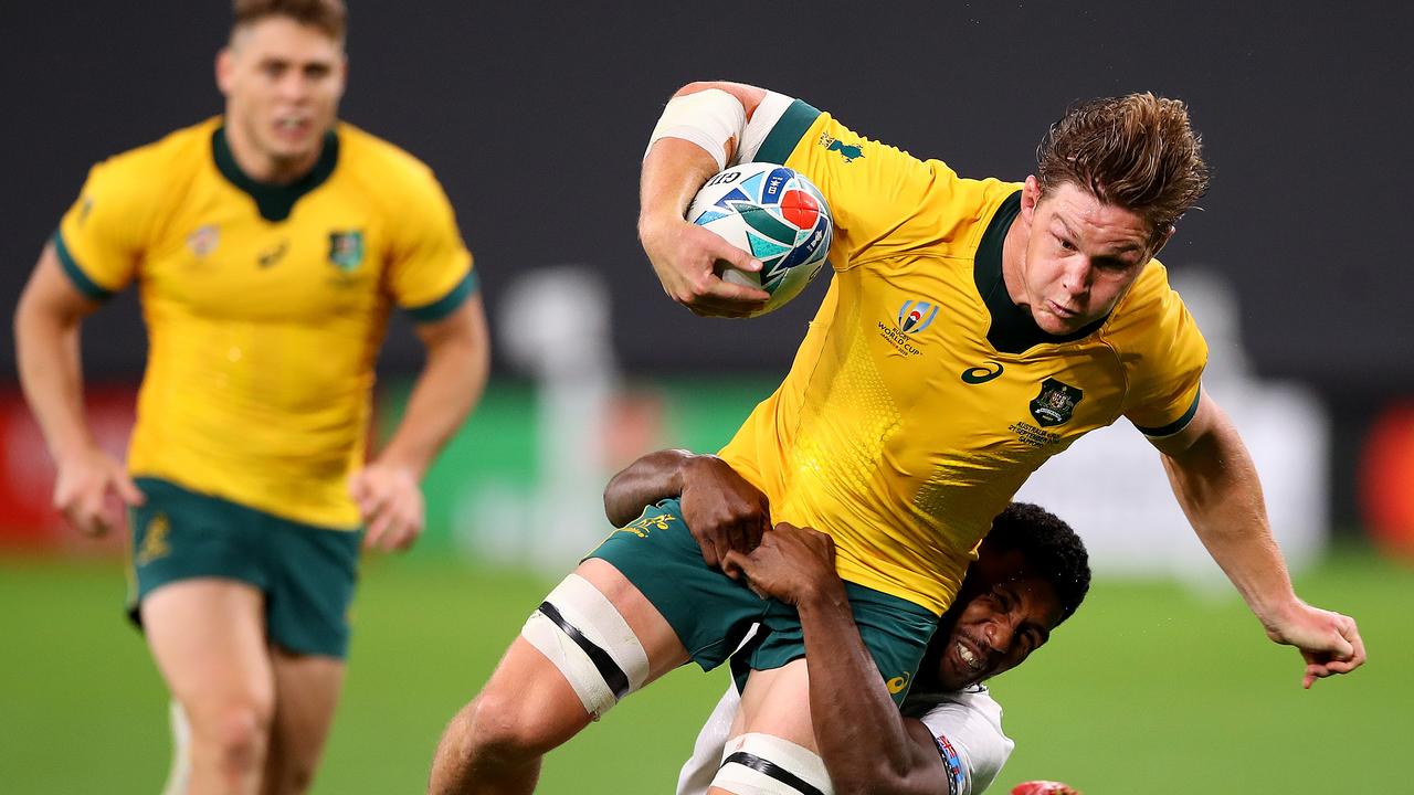 Michael Hooper of Australia is tackled during the Rugby World Cup.
