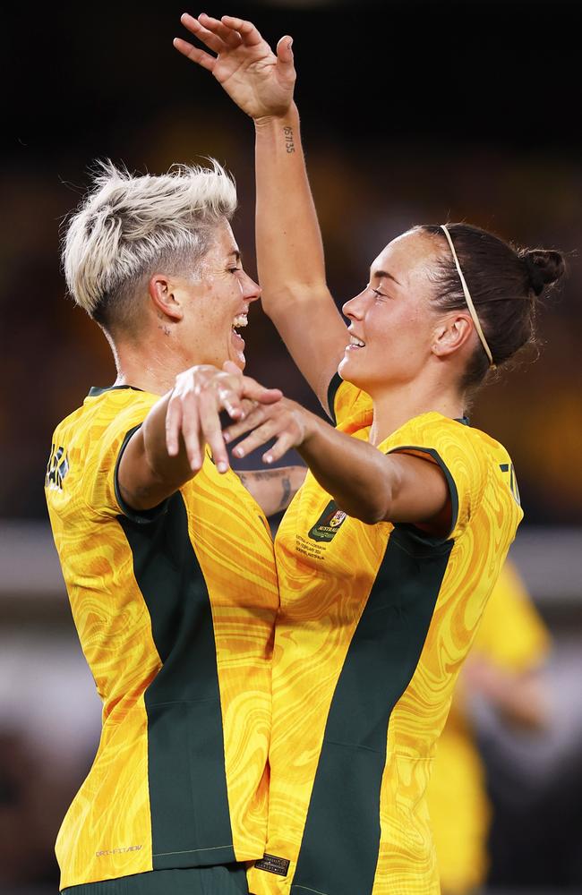 Michelle Heyman and Caitlin Foord celebrate a Matildas goal against Uzbekistan in the Paris 2024 qualifiers at Marvel Stadium, Melbourne. Picture: Darrian Traynor/Getty Images