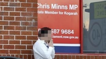 Blurred image: A smoker in front of Chris Minns office