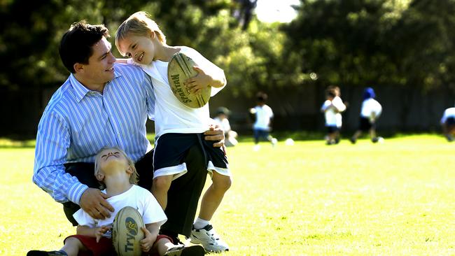 Former Wallaby Rod Kafer with his sons, Ben, 3, and Sam, 6. Sam is now out making his own mark in the game.