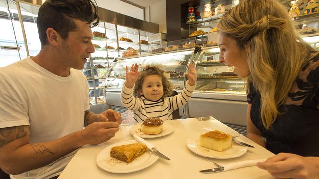 Bessie Kay and husband George Awad with their daughter Indiana at Nikos Quality Cakes. Picture: Norm Oorloff