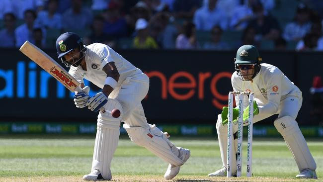 Virat Kohli of India (left) bats as Tim Paine of Australia keeps wickets on day one of the Boxing Day Test match between Australia and India at the MCG in Melbourne, Wednesday, December 26, 2018. (AAP Image/Julian Smith) NO ARCHIVING, EDITORIAL USE ONLY, IMAGES TO BE USED FOR NEWS REPORTING PURPOSES ONLY, NO COMMERCIAL USE WHATSOEVER, NO USE IN BOOKS WITHOUT PRIOR WRITTEN CONSENT FROM AAP