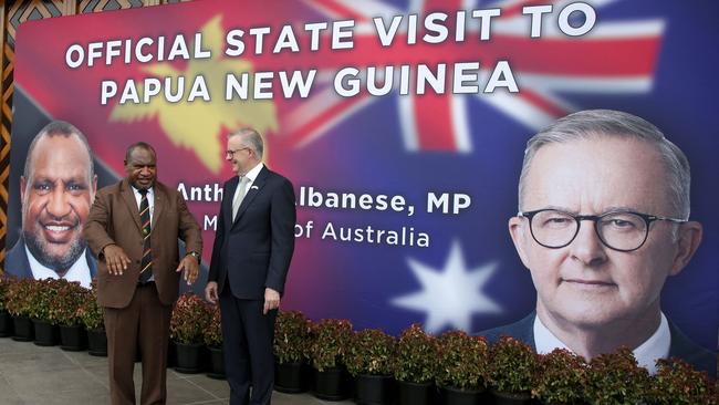 Papua New Guinea's Prime Minister James Marape (left) and his Australian counterpart Anthony Albanese pose for photos prior to their bilateral meeting in Port Moresby on January 12, 2023. Albanese called for a "swift" new security deal with Papua New Guinea, as his government seeks to parry China's expanding influence in the Pacific. (Photo by ANDREW KUTAN / AFP)