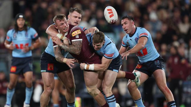 SYDNEY, AUSTRALIA - JUNE 05: J'maine Hopgood of the Maroons is tackled during game one of the 2024 Men's State of Origin Series between New South Wales Blues and Queensland Maroons at Accor Stadium on June 05, 2024 in Sydney, Australia. (Photo by Matt King/Getty Images)