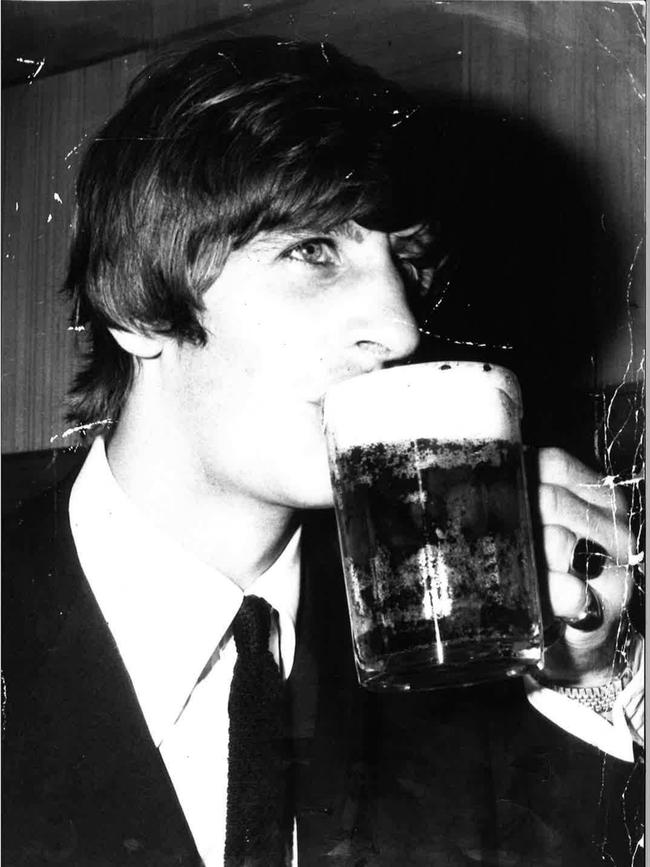 Ringo drinking his first Australian beer. Photos: News Corp Australia