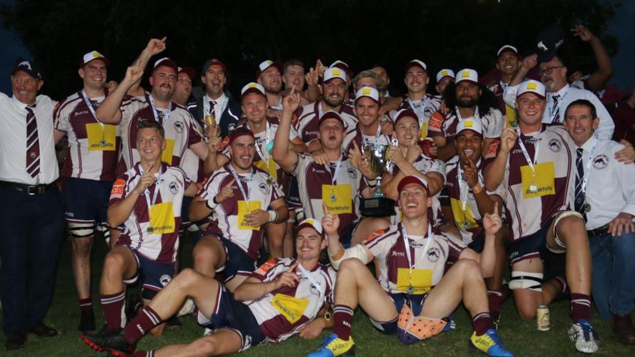 Head coach Michael Phelan (front right) celebrates with his team after winning the 2020 A-grade grand final.