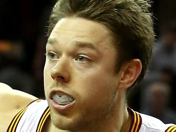 CLEVELAND, OH - DECEMBER 23: Matthew Dellavedova #8 of the Cleveland Cavaliers handles the ball in the second half against the Minnesota Timberwolves at Quicken Loans Arena on December 23, 2014 in Cleveland, Ohio. NOTE TO USER: User expressly acknowledges and agrees that, by downloading and or using this photograph, User is consenting to the terms and conditions of the Getty Images License Agreement. Mike Lawrie/Getty Images/AFP == FOR NEWSPAPERS, INTERNET, TELCOS & TELEVISION USE ONLY ==