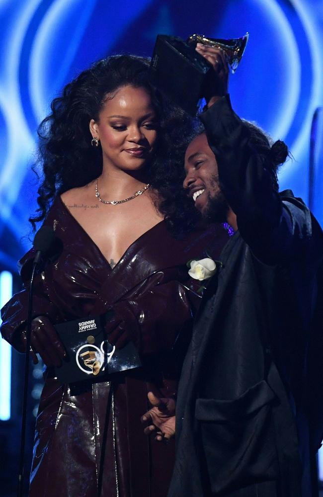 Kendrick Lamar receives a Grammy for the best Rap song from Rihanna. Picture: AFP