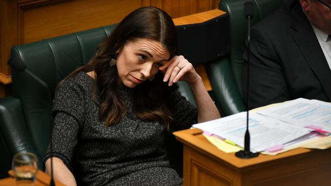 New Zealand prime minister Jacinda Ardern reacts in parliament yesterday. Picture: Mark Graham