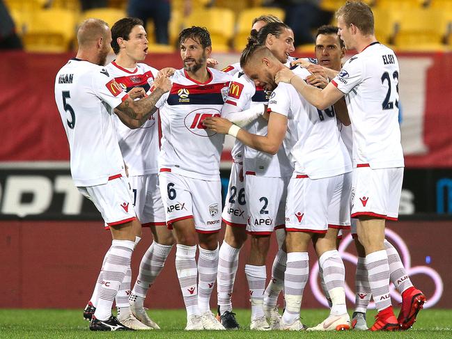 WELLINGTON, NEW ZEALAND - NOVEMBER 24:  Ken Ilso Larsen of Adelaide United celebrates with teammates after scoring a goal during the round five A-League match between the Wellington Phoenix and Adelaide United at Westpac Stadium on November 24, 2018 in Wellington, New Zealand.  (Photo by Hagen Hopkins/Getty Images)