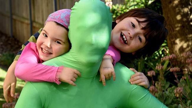 The Hill family - Nick, Fiona, Max, 8, and Jess, 5, all have Lyme disease and are raising money for treatment in Germany. Mr Hall will be running in the Pub 2 Pub in his lime green suit. Photo by Annika Enderborg