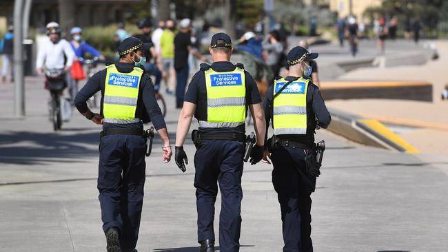 Protective services officers on patrol along the St Kilda Beach foreshore. Picture: William West/AFP