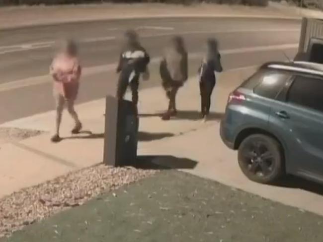 Five youths have been captured on CCTV at the scene of a car crash at Andrews Farm. Police allege the group stole the vehicle, a taxi, from Blair Athol before taking it on a joyride through the northern suburbs. Picture: 7NEWS