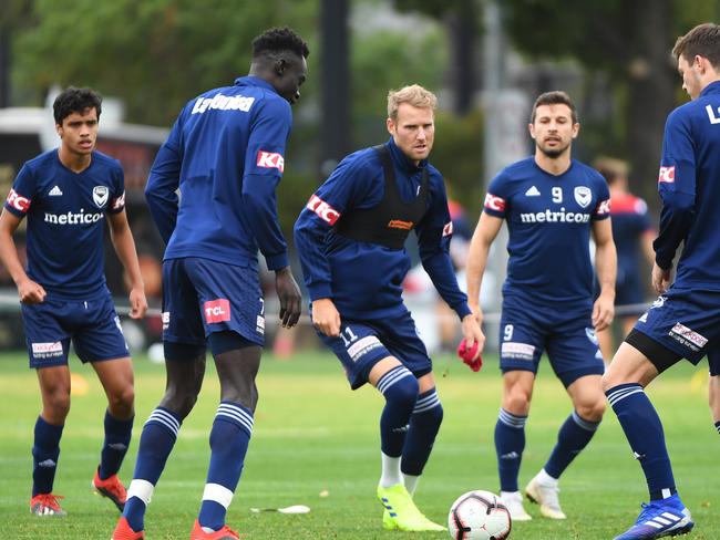 Ola Toivonen (centre) of Melbourne Victory is seen in action during a team training session at Gosch's Paddock in Melbourne, Thursday, February 21, 2019. Melbourne Victory will take on Melbourne City in the round 20 A-Leauge match on Saturday night at Marvel Stadium. (AAP Image/James Ross) NO ARCHIVING