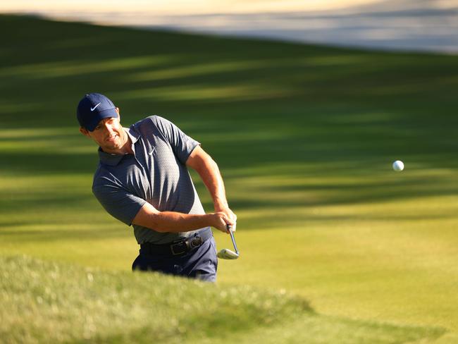 Rory McIlroy of Northern Ireland plays a shot on the 14th hole during the first round of The Players Championship.