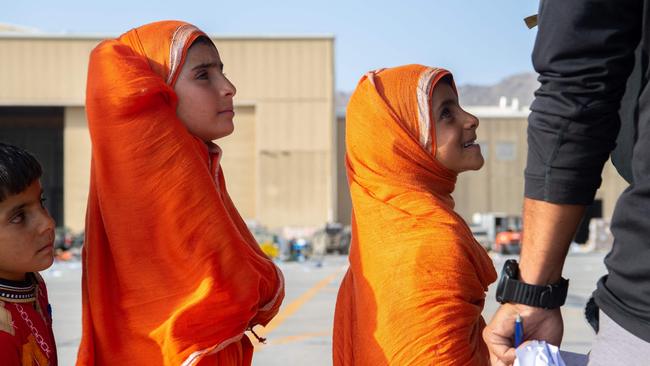 Young passengers waiting to board a US Air Force C-17 Globemaster III. Picture: Supplied