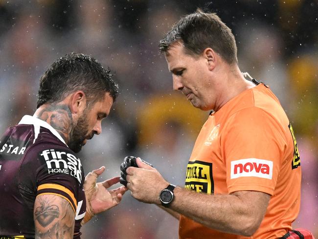 Adam Reynolds receives treatment on field during match against the Bulldogs.