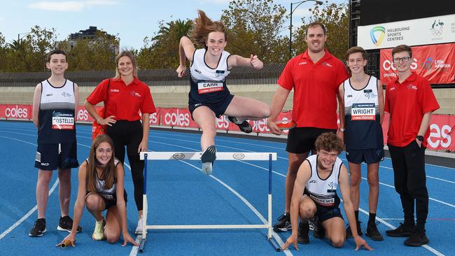 The Coles Australian Little Athletics Championships are back this weekend for the first time in three years, with a historic move to inclusion. From left, multi-class athlete Liam Costello, Madeline Tarabay, Nina Kennedy, Maddison Carr, Olympian Matthew Denny, Asher Andrews, Oscar Wright and Paralympian Jaryd Clifford. Picture: Josie Hayden