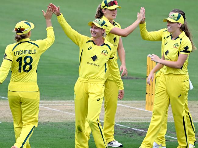 BRISBANE, AUSTRALIA - JANUARY 16: Meg Lanning and Jess Jonassen of Australia celebrate taking the wicket of Fatima Sana of Pakistan during game one of the Womens One Day International series between Australia and Pakistan at Allan Border Field on January 16, 2023 in Brisbane, Australia. (Photo by Bradley Kanaris/Getty Images)