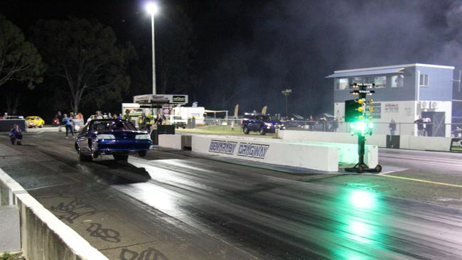 Trevor Batley gets the front wheels up on his Ford Mustang after travelling all the way from Mackay to compete in the CQDRA championship round three at Benaraby Dragway. Picture: Rodney Stevens