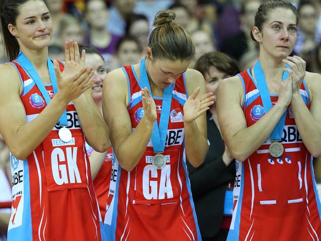 Dejected swifts players after the loss. Netball Grand final between the Firebirds and the Swifts in Brisbane. Pic Jono Searle.
