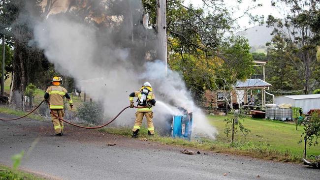 Firefighters attended to a car on fire on Rammutt Rd at Chatsworth on Sunday. Picture: Josie Laird