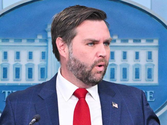 US President Donald Trump (R) looks on as Vice President JD Vance speaks about the mid-air crash between American Airlines flight 5342 and a military helicopter in Washington, in the Brady Press Briefing Room at the White House on January 30, 2025 in Washington, DC. Divers pulled bodies from the icy waters of Washington's Potomac river Thursday after a US military helicopter collided midair with a passenger plane carrying 64 people, with officials saying there were likely no survivors. (Photo by ROBERTO SCHMIDT / AFP)