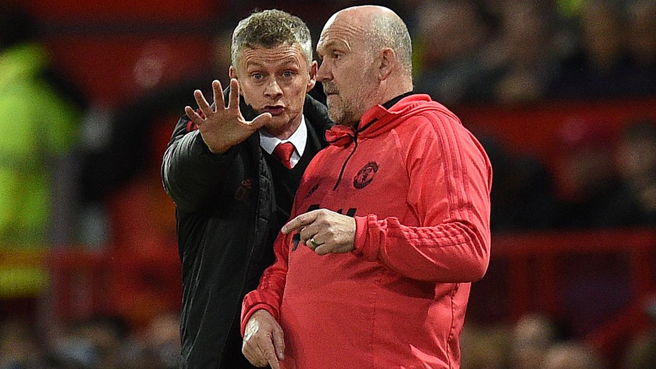 Mike Phelan has signed a three-year deal to remain as Manchester United’s assistant coach.