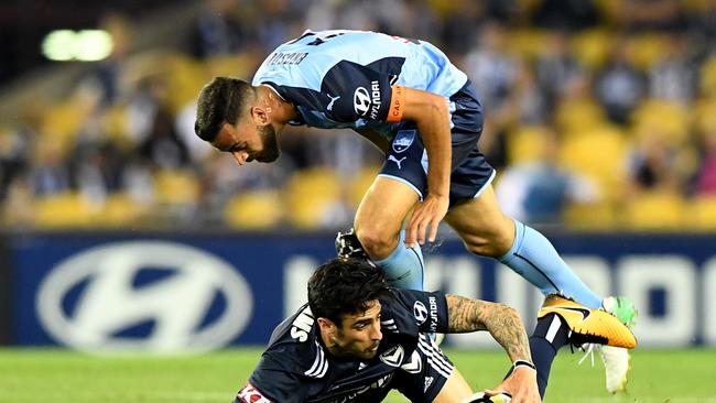 Rhys Williams is tackled by Alex Brosque during the round 1 A-League clash. Picture: AAP