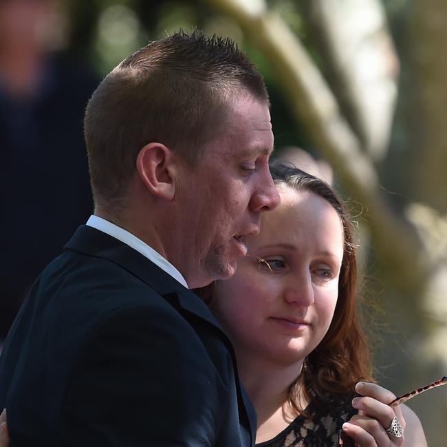 David Turner is consoled during the funeral of his wife Kate Goodchild, who died in the Dreamworld disaster. Picture: AAP Image/Lukas Coch