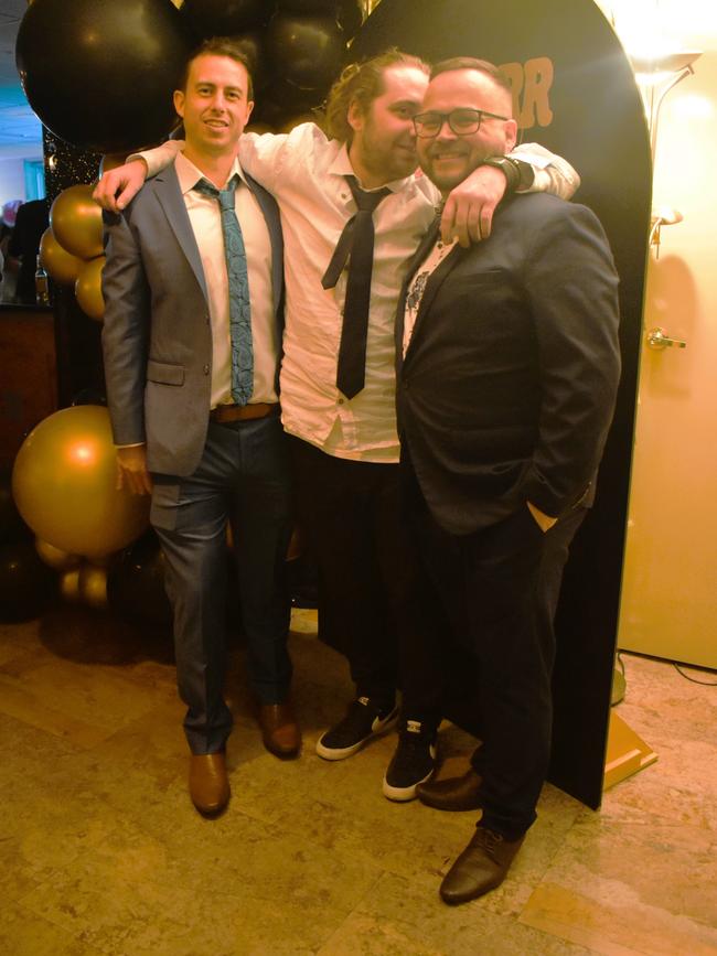 Sam Scammell, Aaron Amory and John Burt having a great night at the Cowwarr Saints Football &amp; Netball Club Golden Gala Ball 2024. Picture: Jack Colantuono