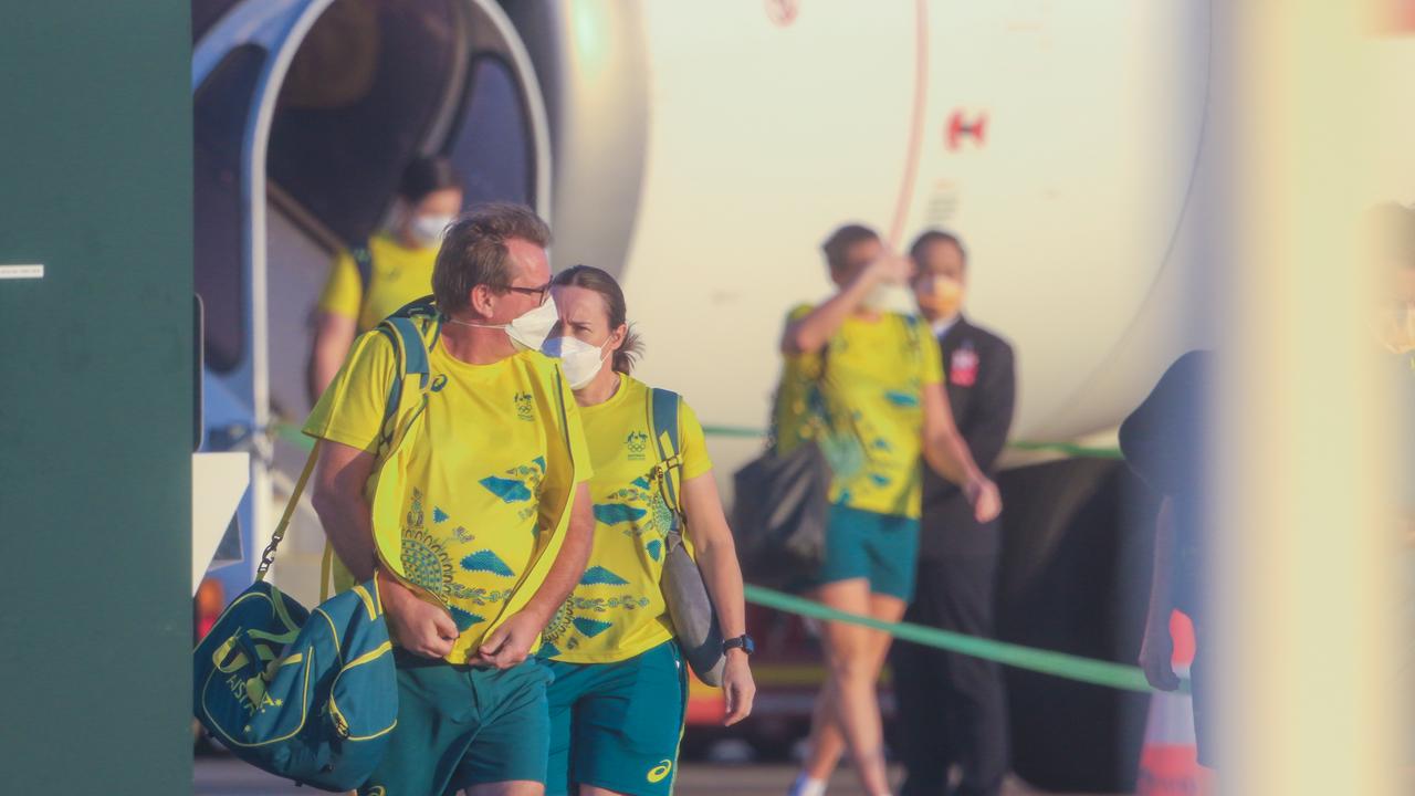 24 hours after the closing ceremony Australians Olympians arrive at Darwin International Airport en route to Howard Springs for 14 Days Quarantine. Picture: Glenn Campbell