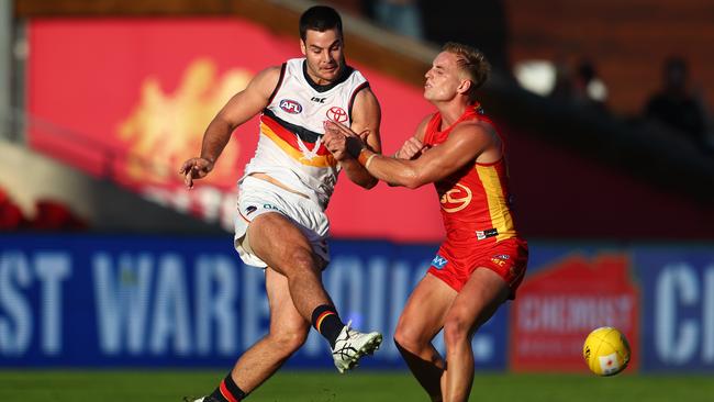 Darcy Fogarty gets a clearing kick away against Gold Coast. Picture: Chris Hyde (Getty).