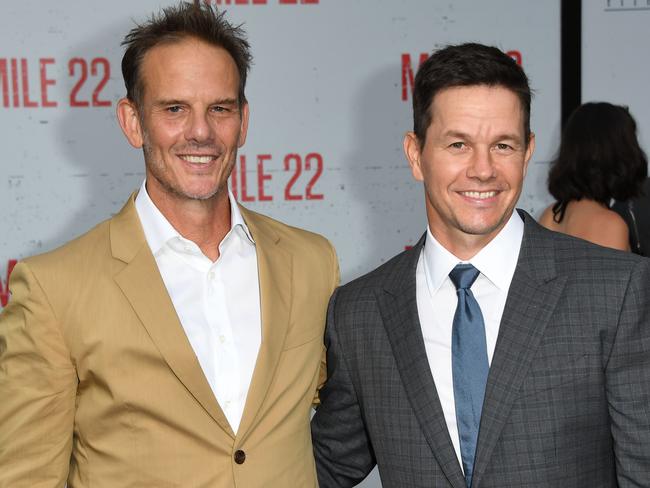 Director Peter Berg and actor Mark Wahlberg arrive for the LA premiere of Mile 22. Picture: Mark Ralston /AFP