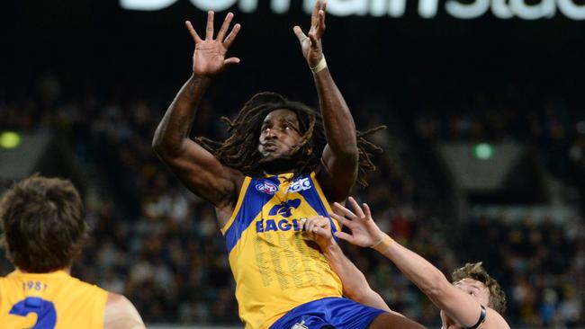 Naitanui flies for a mark over Adelaide's Matt Crouch. Picture: Daniel Wilkins