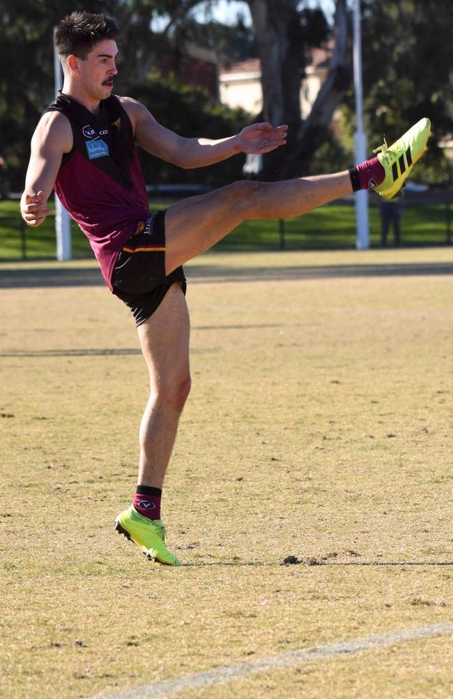 Noah Gown boots a goal for Old Haileybury.