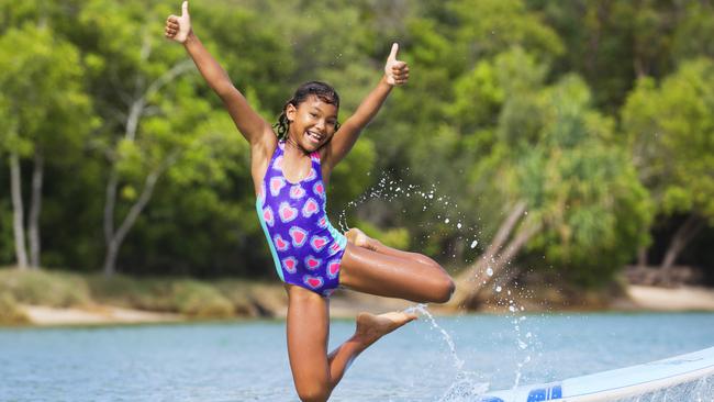 8 year old Kiri Todhunter from Ninderry kicked off her school holidays with a splash at Noosa River, followed by fish and chips on the beach. Picture: Lachie Millard