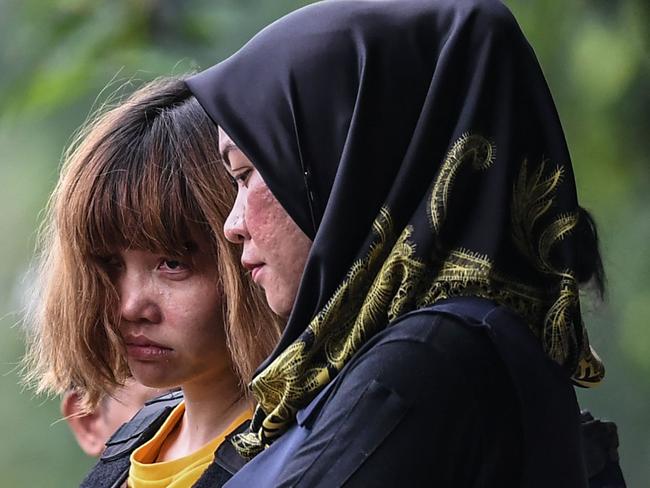 Vietnamese national Doan Thi Huong, 28, is escorted with a heavy police presence after a court appearance with Indonesian national Siti Aisyah, 25, at the magistrates' court in Sepang. Picture: AFP