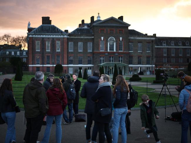 Journalists and bypassers gather outside Kensington Palace in London after the Princess of Wales announced that she has cancer and was in the early stages of chemotherapy, asking for "time, space and privacy" as she finishes her treatment. Picture: Henry Nicholls/AFP
