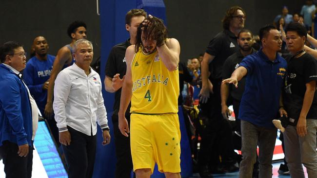 Chris Goulding in the aftermath of being set upon by several Philippines players and officials. Picture: AFP