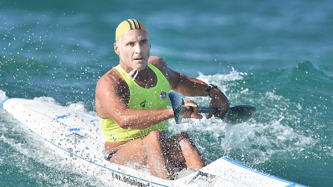 Dad Grant Kenny competiing in the surf life saving championships. Credit: Harvpix