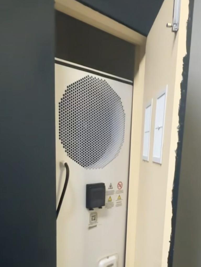 A heat pump installed inside a cupboard, - which technicians say offers very little energy savings due to the lack of open space. Picture: Supplied