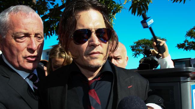 US actor Johnny Depp (right) and his longtime bodyguard Jerry Judge on the Gold Coast. Picture: AFP/Patrick Hamilton.