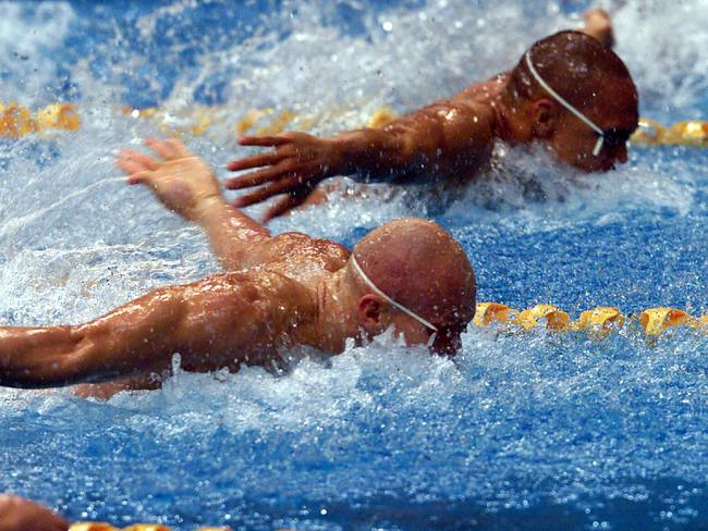 Michael Klim and Geoff Huegill swimming in the 100m butterfly final at the Sydney Olympics.