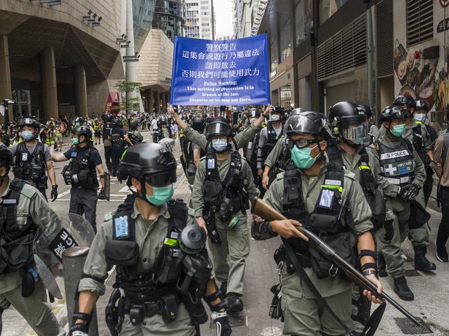 Riot police stand guard during a protest in Hong Kong. Picture: Getty