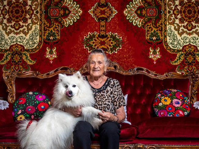 Julijana Iveges, 89, and her dog Pici Maci inside her Richmond home of more than 50 years. The family moved into the house in the 1960s, when it was a boarding house and sleeping up to 18 people at a time. They lived in a room with red carpet on the wall. The boarding house closed and the family turned it into a family home in the 1980s. Picture: Jake Nowakowski