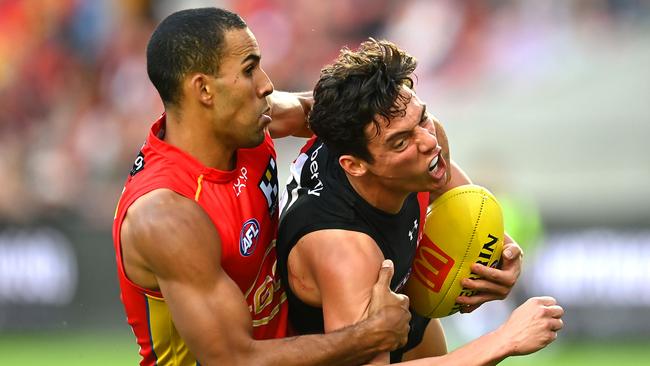 Jye Caldwell of the Bombers is tackled by Touk Miller of the Suns. (Photo by Albert Perez/AFL Photos via Getty Images)