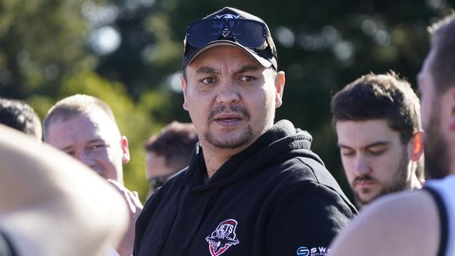 Ryan Hoy speaks to the Black Rock players. Picture: Valeriu Campan