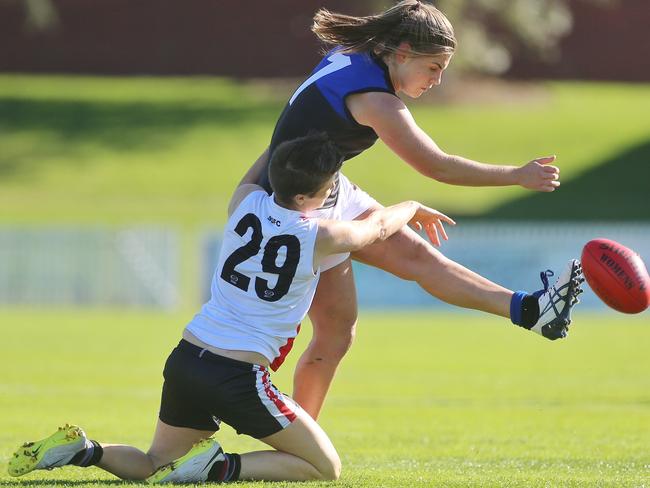 Madeline Keryk of Melbourne Uni is tackled by Alex Whitehead of St Kilda during the VFL Women's match between St Kilda and Melbourne Uni played at North Port Oval on Saturday, May 14, 2016, in Port Melbourne, Victoria, Australia. Picture: Hamish Blair