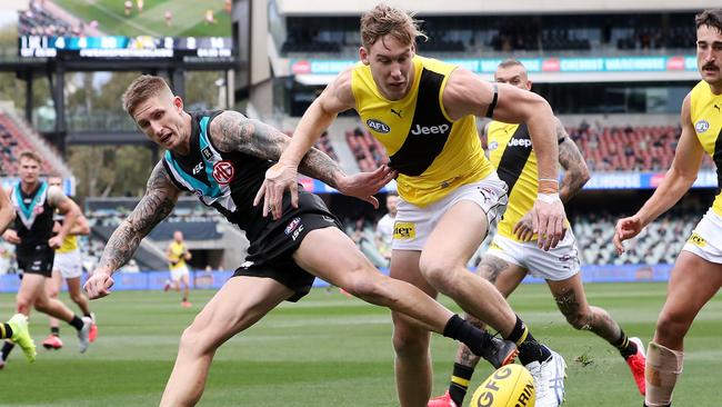 Port Adelaide’s Hamish Hartlett and Richmond's Tom Lynch Richmond compete for the ball at Adelaide Oval. Picture: Sarah Reed